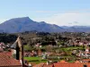 His church and views of the Pyrenees