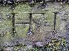 Henri-Frédéric Iselin's initials on his stone bench (© J.E)