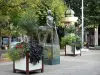 Agen - Cathedral square: centaur statue, flowers and trees