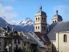 Briançon - Upper town (Vauban citadel, fortified town built by Vauban): towers of the Notre-Dame collegiate church and houses of the old town, view of the mountains with snowy tops (snow)