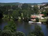Cahors - The River Lot with boats, leisure park of the Cabessut island, houses, buildings and hills, in the Quercy