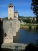 Cahors - Towers and fronts of the Valentré bridge (fortified bridge) and the River Lot, in the Quercy