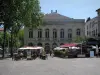 Cahors - Municipal theatre, trees and café terraces of the François-Mitterrand square, in the Quercy