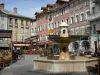 Gap - Jean Marcellin square: fountain, café terraces, shops and houses with colourful facades of the old town