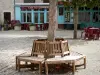Lauzerte - Wooden bench on the Place des Cornières square 