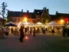 Jugglers and books on the village square