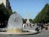 Реймс - Место Drouet-d'Erlon: фонтан, деревья и фонтан Subé на заднем плане