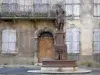 Alet-les-Bains - House facade and fountain on the Place de la République square