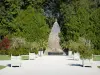 Ancy-le-Franc castle - Pyramid-shaped fountain and potted shrubs in the formal garden