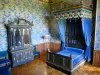 Ancy-le-Franc castle - Interior of the Renaissance palace: four-poster bed in the blue and black bedroom