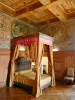 Ancy-le-Franc castle - Interior of the Renaissance palace: four-poster bed and medallions in the Arts room