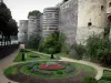 Angers - Towers of the feudal castle (medieval fortress home to the Tapestries museum), garden (flowerbeds) and trees