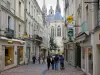 Angers - Buildings and shops of the Saint-Aubin street with view of the chevet of the Saint-Maurice cathedral