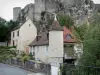 Angles-sur-l'Anglin - Ruins of the fortified castle (medieval fortress) on a rocky mountain spur, houses of the village and trees