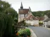 Angles-sur-l'Anglin - Saint-Croix chapel, bridge featuring flowers spanning the River Anglin, weeping willow, lamppost and houses of the village