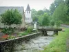 Aspe valley - Lourdios-Ichère: stone house and bell tower of the Saint-Isidore church on the riverside