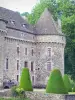 Auzers castle - Corner tower of medieval castle and boxwood