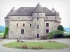 Auzers castle - Main building with its staircase tower and its flowery surroundings