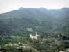 Balagne region - Church and houses surrounded by hills