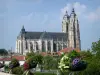 Basilica of Saint-Nicolas-de-Port - View of the gothic-style Saint Nicholas Basilica, with flower pots in the foreground