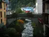 Beaufort - Stone bridge spanning a river and houses of the village