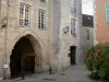 Bellême - Porch (remains of old walls) and facades of houses in the old town; in the Perche Regional Nature Park