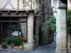 Billom - Paved street, flowers and houses in the medieval town (medieval quarter)