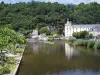 Brantôme - Dronne river, trees, walk of the Moines garden (on the left), Benedictine abbey, pavilion of the Renaissance period, the Saint-Roch tower and forest, in Green Périgord