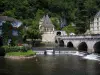 Brantôme - Coudé bridge spanning the River Dronne, pavilion of the Renaissance period, Saint-Roch tower and convent building of the abbey (on the right), in Green Périgord