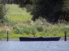 La Brenne Regional Nature Park - Boat on a lake, reed and trees
