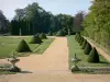 Busset castle - French-style formal garden with hand-clipped shrubs, lawns and flowers