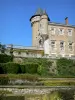 Busset castle - Orion tower and main building overlooking the Italian-style garden