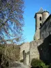 Camon - Bell tower of the church (old abbey church), walls and trees