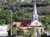 Case-Pilote - Vista de la fachada y el campanario de la iglesia de Nuestra Señora de la Asunción y de San José