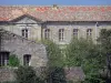 Cassan abbay-castle - Abbaye-castle (former royal priory) and trees, in Roujan