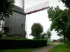 Cassel - Casteelmeulen, wooden windmill on pivot situated at the top of the Cassel mountain, path lined with lawns and trees of the public garden