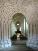 Celles-sur-Belle royal abbey - Inside the Notre-Dame abbey church: Romanesque portal with lobed arches and nave