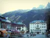 Chamonix-Mont-Blanc - Winter and summer sports resort (climbing capital): square of the city with houses, shops, Saussure and Balmat statue, Casino and view of the Mont Blanc mountain range