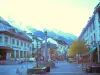 Chamonix-Mont-Blanc - Winter and summer sports resort (climbing capital): fountain, trees and houses of the city with a view of the Mont Blanc mountain range