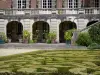 Château de Courances - Castle, potted plants and box tree broderie of the French-style formal garden