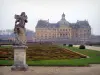 Château de Vaux-le-Vicomte - Facade of château of Classical style and formal gardens of Le Nôtre with embroidery-like flowerbeds, statue and alleys