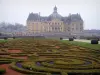 Château de Vaux-le-Vicomte - Embroidery-like flowerbeds of the formal gardens of Le Nôtre with a view of the château and its outbuildings