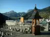 Châtel - Forged iron rail with view of the parking with lampposts, forests and surrounding mountains, in Chablais