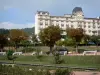 Châtel-Guyon - Spa resort: building and Parc Thermal spa garden with blooming rosebushes; in the Auvergne Volcanic Regional Nature Park