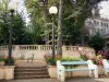 Châtel-Guyon - Spa resort: Parc Thermal spa garden with lampposts, benches, chairs, flowers and trees