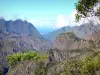 Cilaos cirque - Réunion National Park: vegetation and ramparts of the Cilaos cirque, with view in the distance of the Indian Ocean