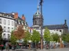 Clermont-Ferrand - Jaude square: tram station, trees, buildings and dome of the Saint-Pierre-les-Minimes church
