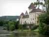 Cléron castle - Fortified castle, Loue river and trees along the water