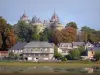 Combourg - Feudal castle (fortress) dominating the pond and houses of the city
