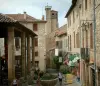 Cordes-sur-Ciel - Covered market hall, stone houses and bell tower of the Saint-Michel church